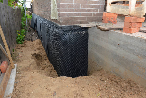 Happy homeowners after waterproofing job in East Liberty